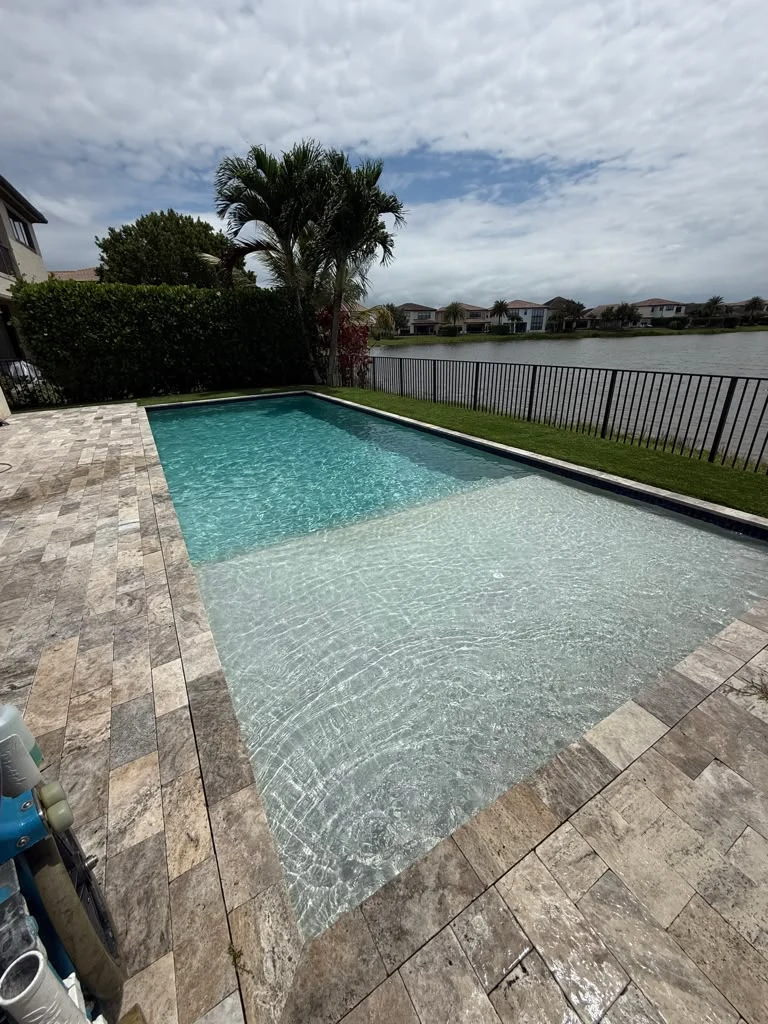 Maintained rectangular pool with a shallow sun shelf and clear water